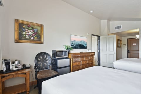 Guest bedroom entrance, flat screen TV, Keurig coffee maker and full bathroom