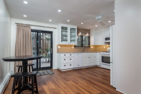 Kitchen with Slider to Dining Deck and Backyard