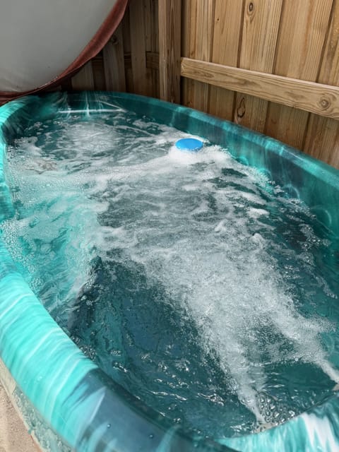 Private bubbling hot tub for the perfect relaxing soak