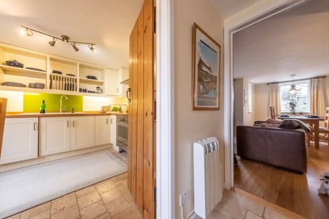 Ground floor: Hallway looking into kitchen and sitting room