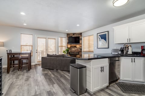 Kitchen living room area with HDTV w/DISH satellite and easy warm gas fireplace.
