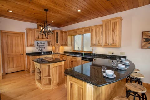 Massive Kitchen with Bar Stool Seating for Four