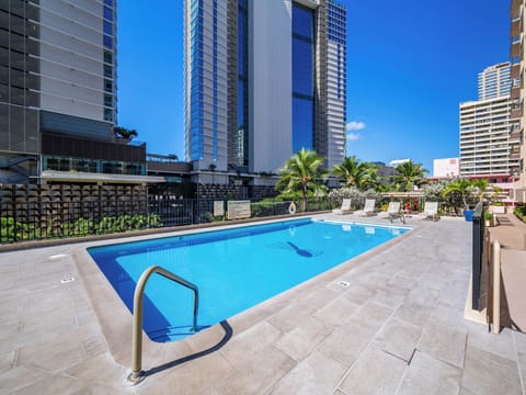 Pool - Enjoy the best of island leisure at the Four Paddle pool deck—ample seating, sunny views, and tropical calm right in the heart of Honolulu.