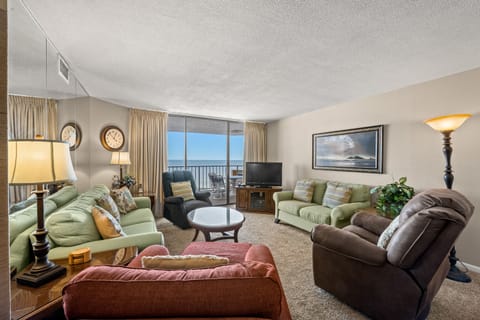 The ocean front living room is well-appointed with comfortable furnishings.