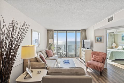The ocean front living room is well-appointed with comfortable furnishings.