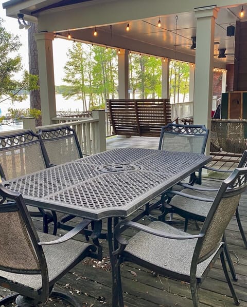 There is another patio table on the deck. It is right by the grill. 