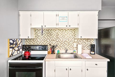 Boutique Beach Retreat Full Size Kitchen and seating area with Refrigerator  Oven Range,  Coffee Maker Utensils, dishes and cooking basics