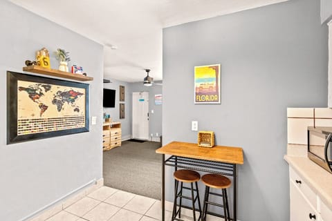 Boutique Beach Retreat Treasure Island full kitchen, stove refrigerator, freezer, microwave, coffee maker, kitchen utensils and flatware kitchen table