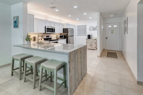 Brand new kitchen with granite waterfall countertop.