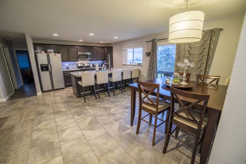 Modern kitchen with granite countertops and oversized island.