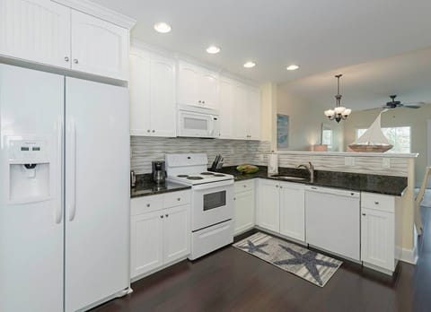 Another view of this fully stocked kitchen.