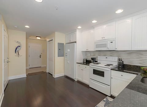 View from the dining area of the kitchen/entrance.