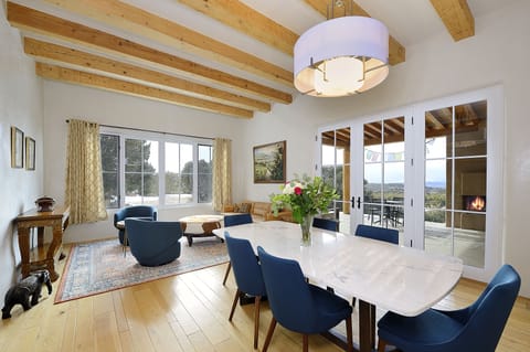 Open space dining and living area - patio doors to portico with outside seating