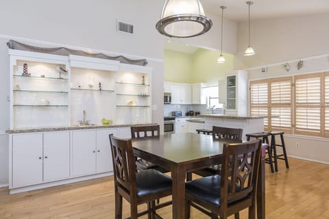 The open-concept dining area on the 2nd floor sits between the kitchen and living room, creating a seamless space for meals and gatherings.