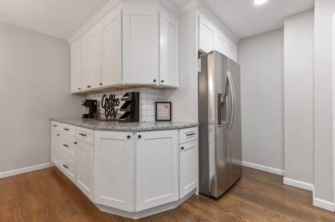 Large double door refrigerator with ice/water in door and coffee bar.