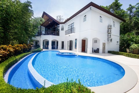 "Treat yourself to a luxurious escape with this five-bedroom luxury home in Costa Rica - take a dip in the pool and enjoy the magnificent resort amenities!"