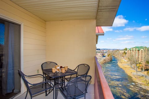 Relax on your own private balcony listening to the river flow by. 