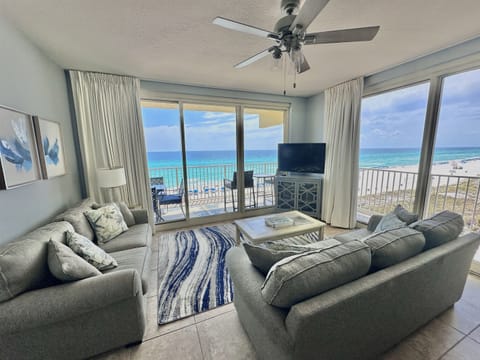 Bright Coastal Living Room with Floor-to-Ceiling Views