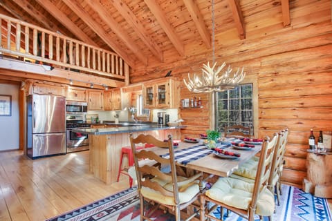 Dining area seats 8, plus 4 at buffet bar, rustic decor with modern amenities