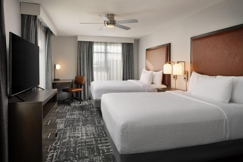 Suite, 2 Queen Beds, Corner | Desk, laptop workspace, blackout drapes, iron/ironing board