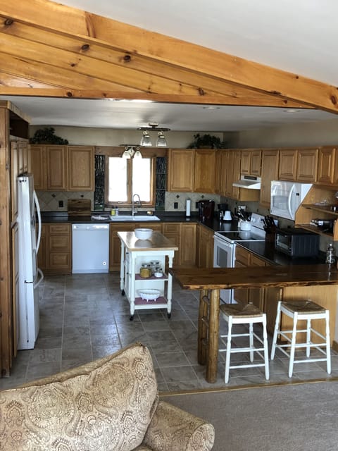 Spacious fully stocked with dining and cooking essentials. Breakfast bar for 2.