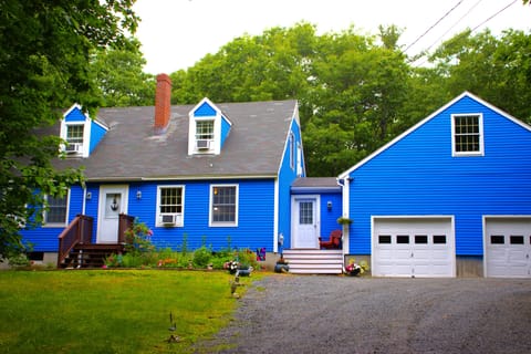 Front exterior of house with garage and driveway