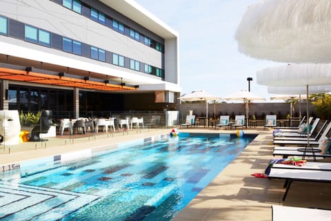 Outdoor pool, pool umbrellas, sun loungers