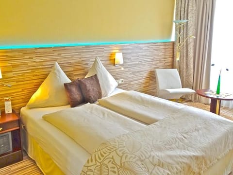 Hypo-allergenic bedding, desk, laptop workspace, blackout drapes