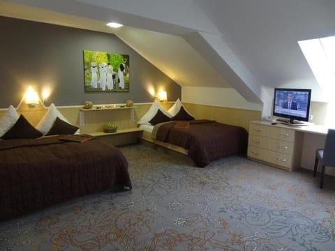 Hypo-allergenic bedding, desk, laptop workspace, blackout drapes