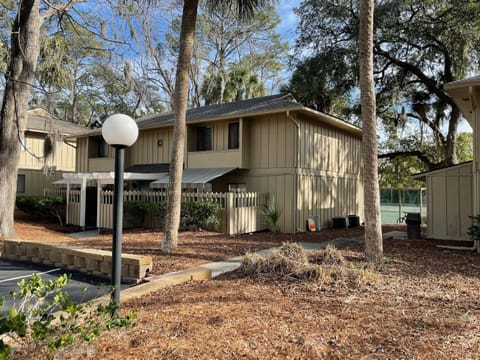 The view of our building, the patio is behind the fence under the awning