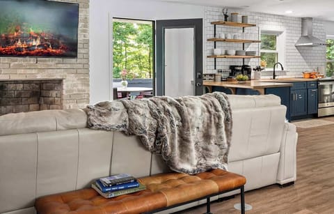 Lounge on the high end leather sofa watching your favourite TV show.