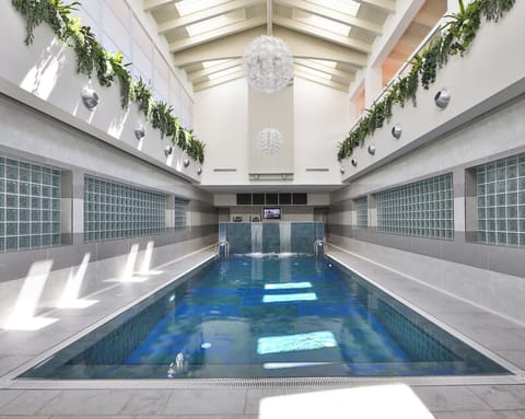 Seasonal outdoor pool, open 9:30 AM to 8:00 PM, pool umbrellas