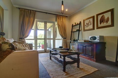 Manor House Deluxe Suite | Living area | Flat-screen TV, DVD player