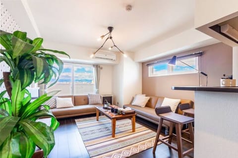 Apartment, Non Smoking | Living area | Flat-screen TV