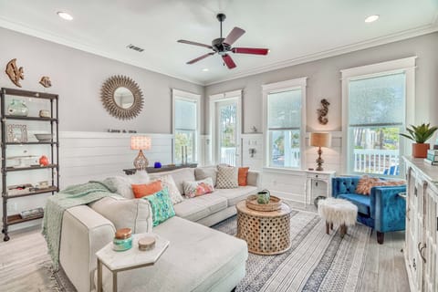 Sink into plush seating surrounded by coastal charm in the main living room.