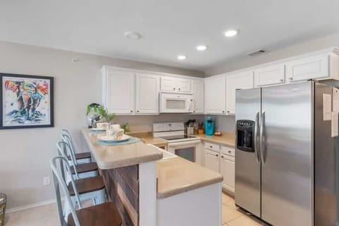 Cozy kitchen nook with bar seating.