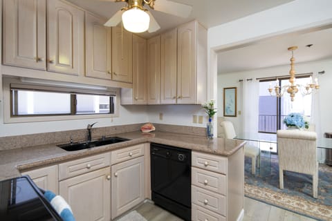 kitchen and dining area with patio in the background 