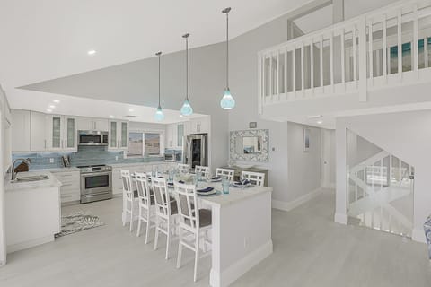 Island kitchen w/ stainless appliances including 35 CF luxury refrigerator