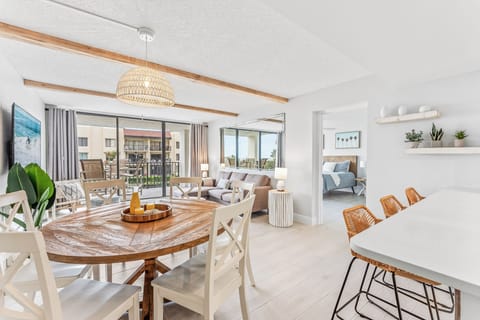 Elegant dining area with a rustic-modern design, woven light fixture, and natural wood accents.