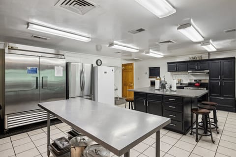 Huge kitchen! 3 fridges/freezers, 2 dishwashers, 2 gas and 1 electric stove.