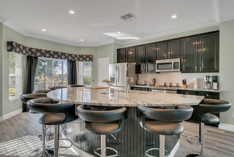 Breakfast Bar And Full Modern Kitchen