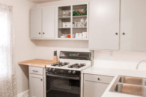 Cook UP! Kitchen stocked with plates, pots, pans, cups, electric griddle & more!