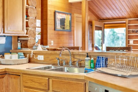 The fully stocked kitchen with all updated appliances and vaulted ceilings.