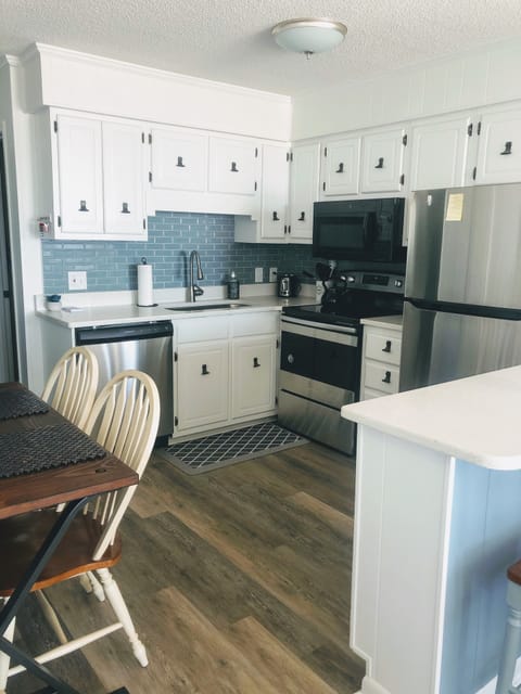 Kitchen with new appliances and backsplash