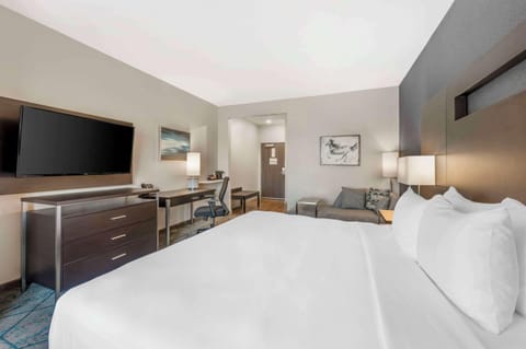 Premium bedding, desk, laptop workspace, iron/ironing board