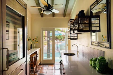 Wet bar area, built in ice maker with view out to the patio area.