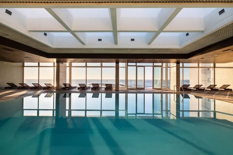 Indoor pool, pool umbrellas, sun loungers