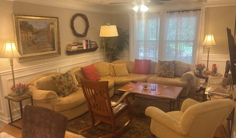 Living room features a 58” Roku TV, board games, great books & seating up to 8