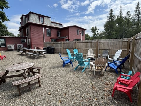 1 of 2 outdoor amenity spaces! We have 2 firepits, BBQs, Adirondack chairs, fire starter, fire wood, games and more!