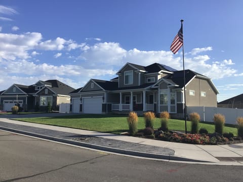 Front of house, basement entrance is behind gate on the left.
